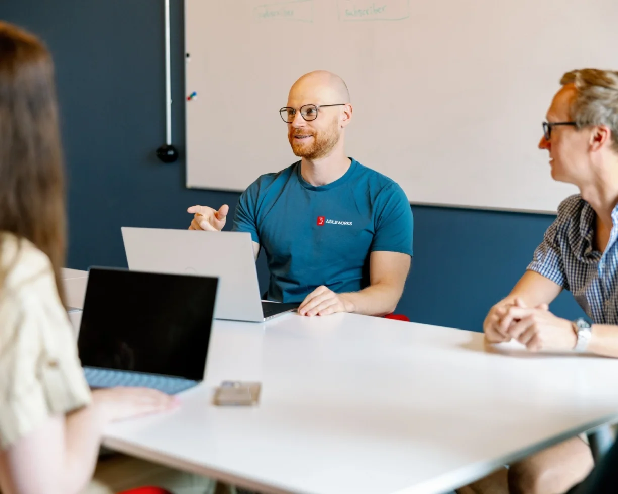 Agileworks workers in a meeting